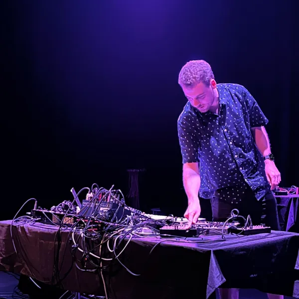 A young male musician playing synth music