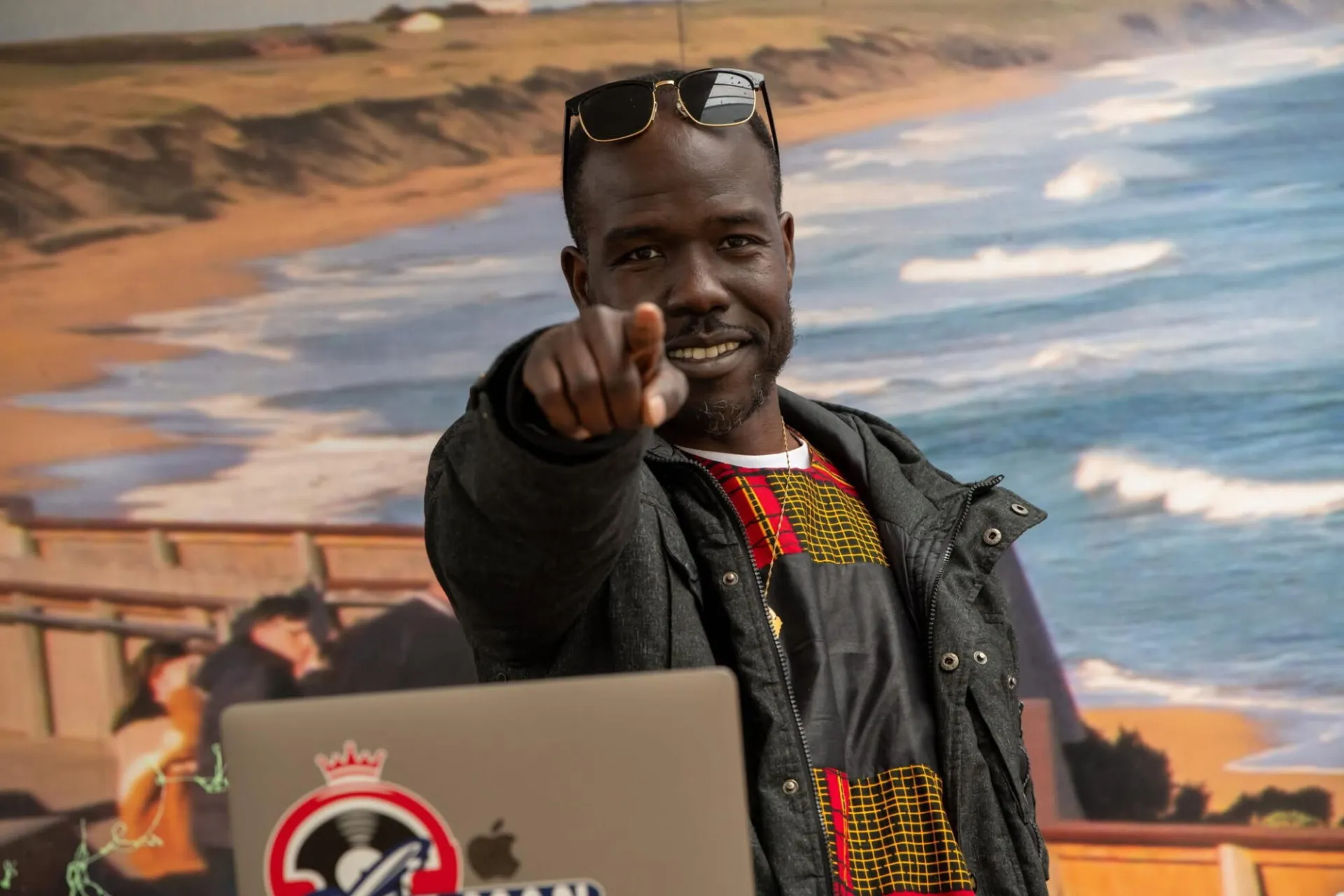 Dj E-Man playing in front of a beach 