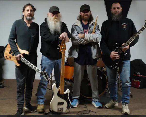 Four male musicians looking very rock n roll