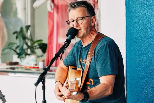Male performer with guitar singing